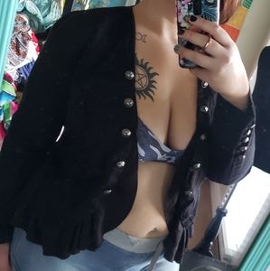 Edgy black blazer with ruffle detail